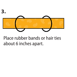 The top half of the coffee filter, with the curved edge at the top, is placed in the center of the folded bandanna. Then, fold filter in center of folded bandanna. Fold top down. Fold bottom up, to cover the filter entirely.